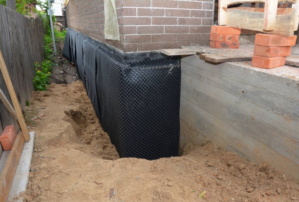 Happy homeowners after waterproofing job in Luther